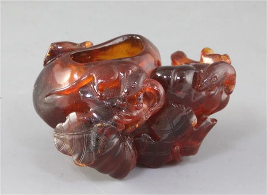A Chinese amber brushwasher, Qing dynasty, 7cm long